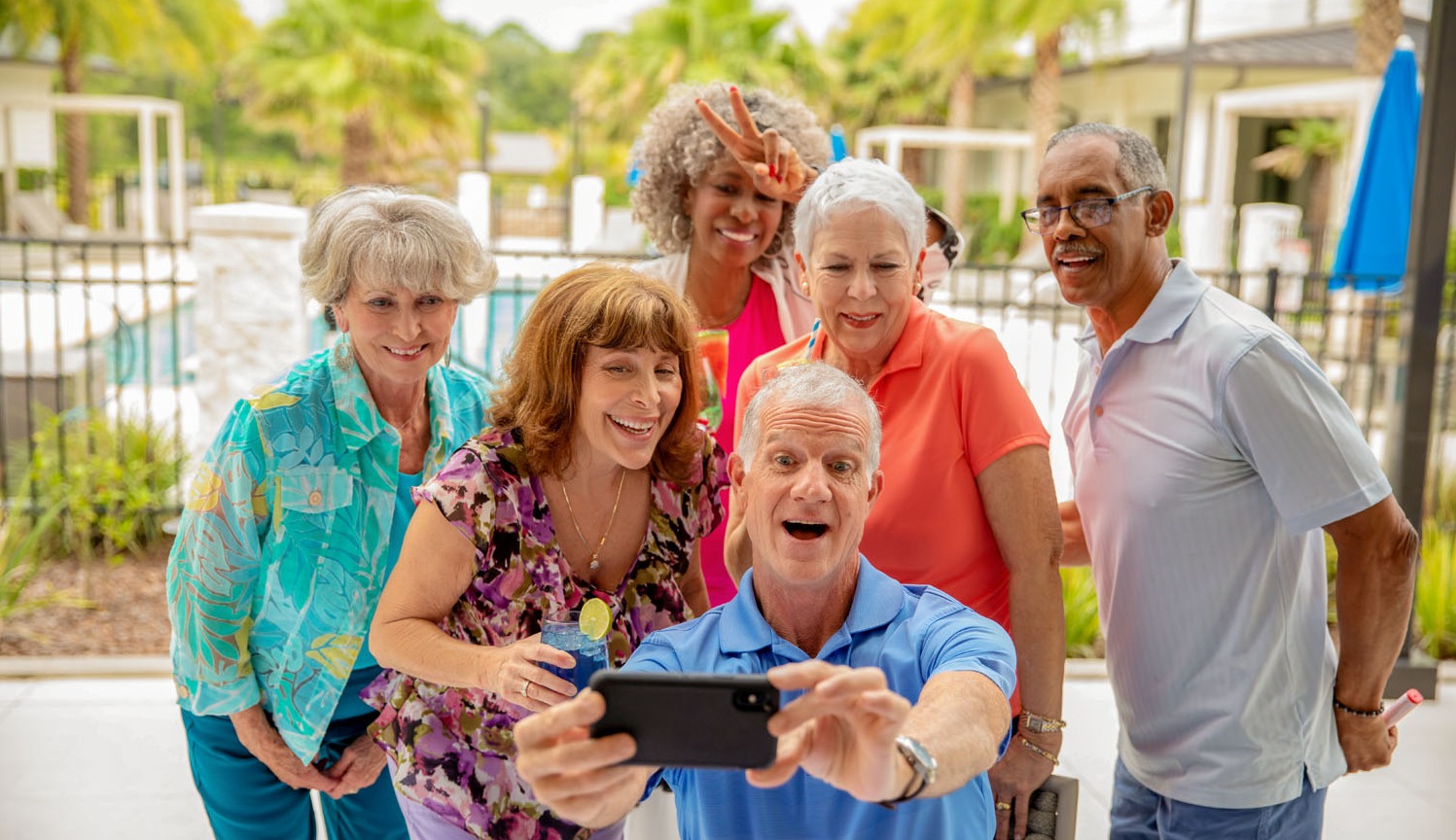 arbor terrace residents taking group photo at Patio Party