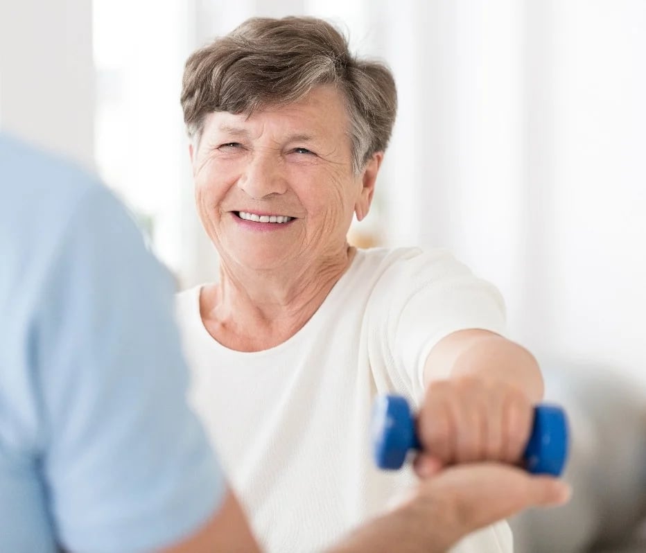 arbor terrace resident exercising in fitness class