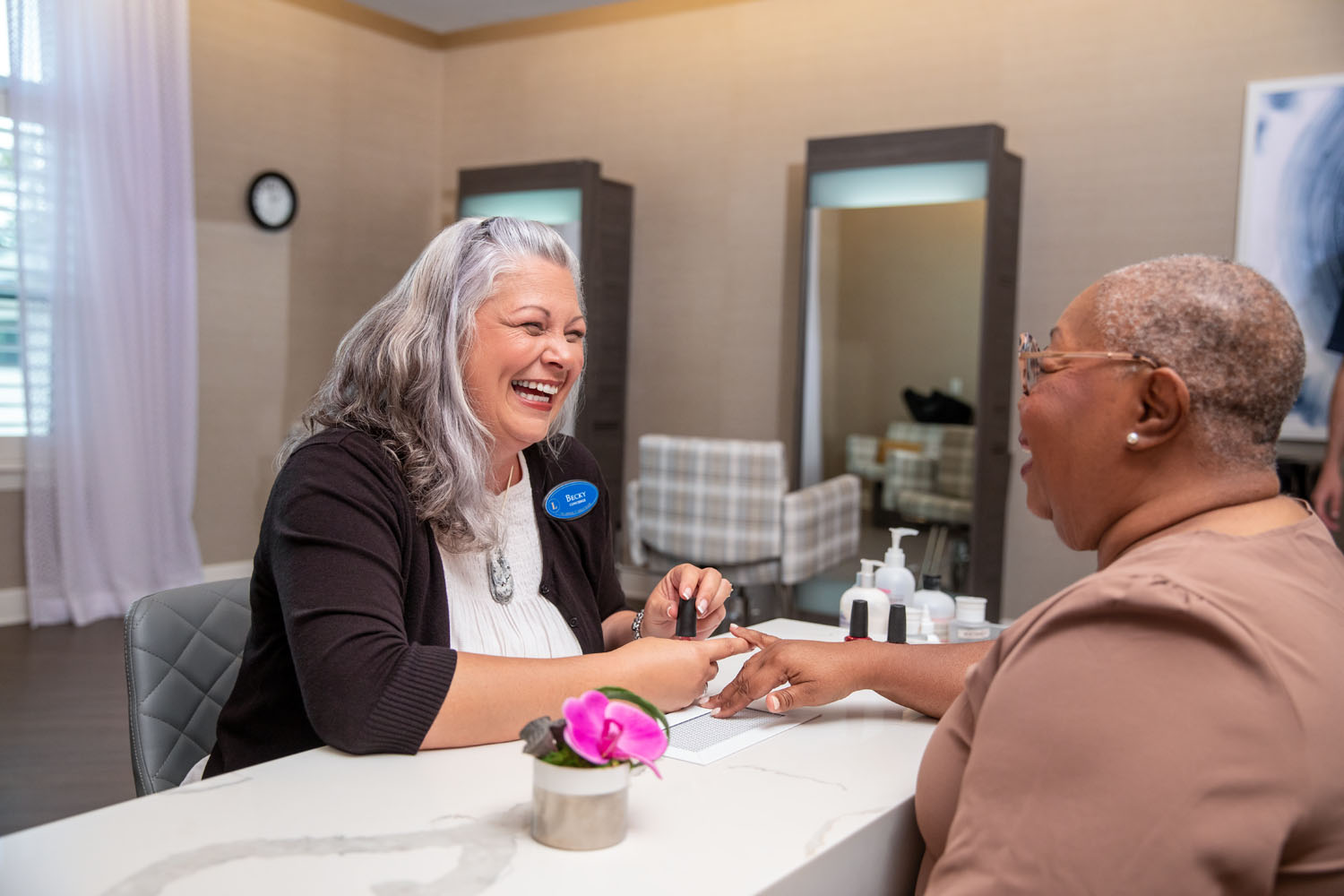 arbor terrace staff painting resident's nails
