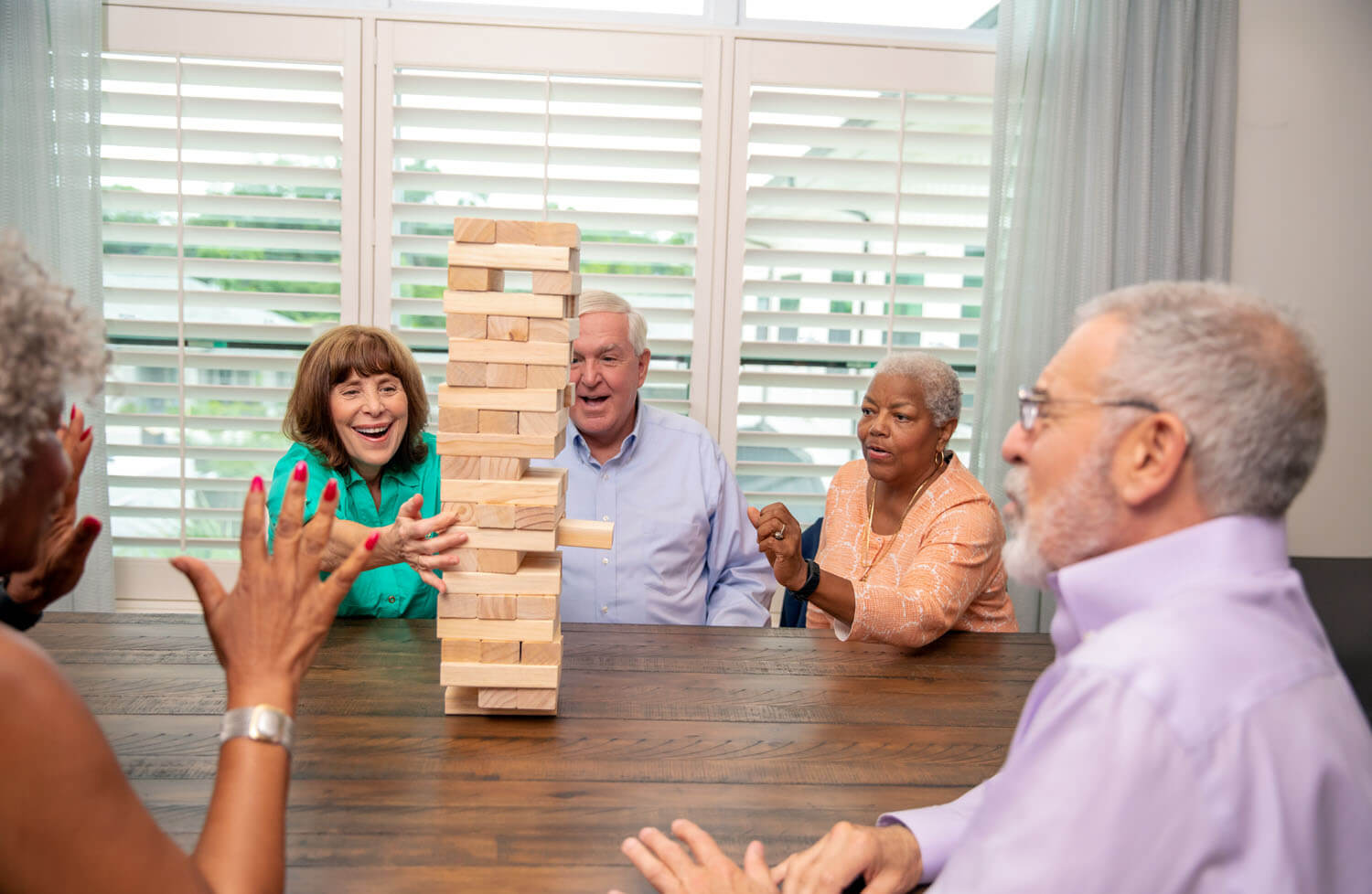 arbor terrace residents playing in Game Room