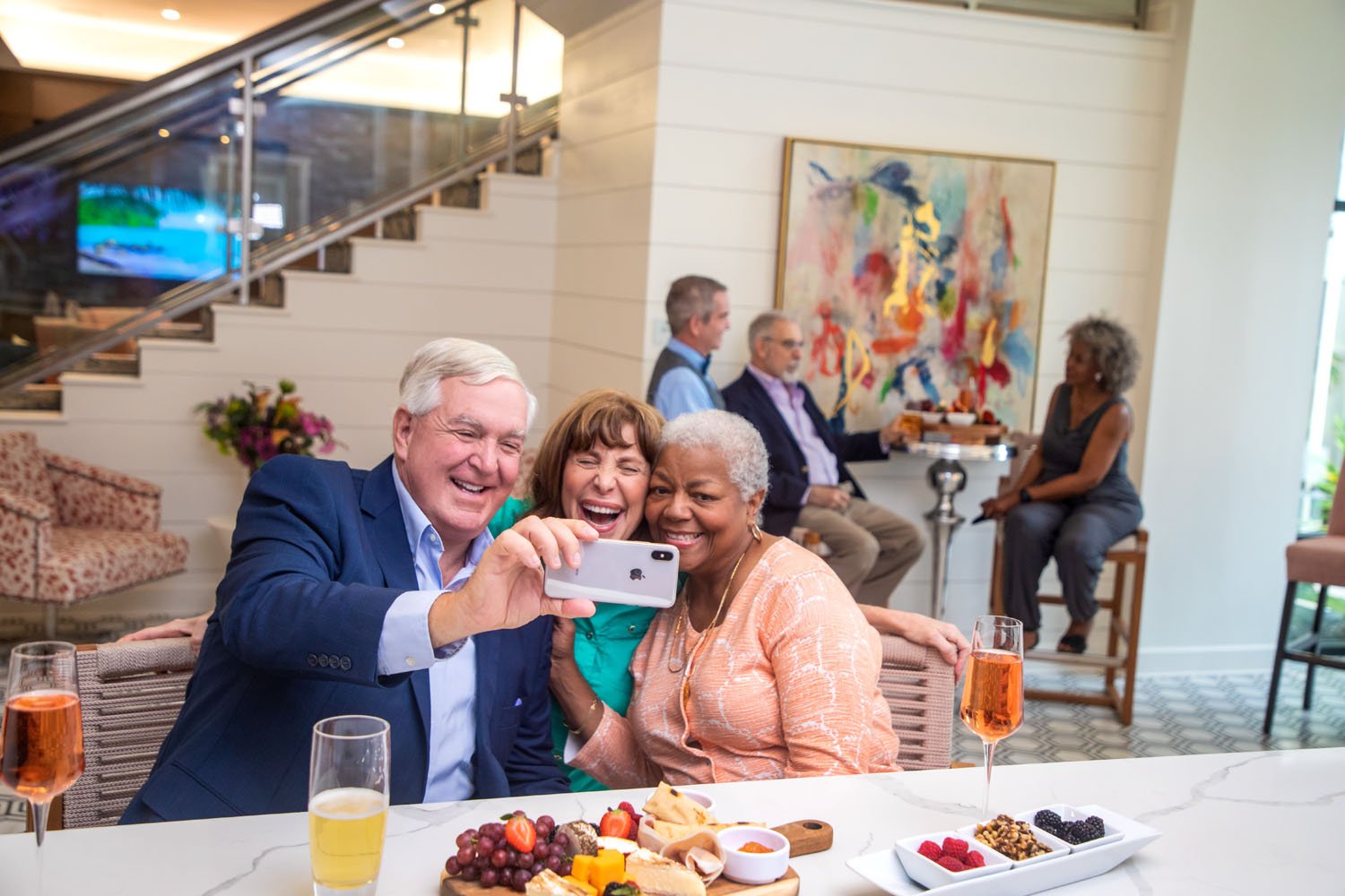 arbor terrace residents taking selfie by bar