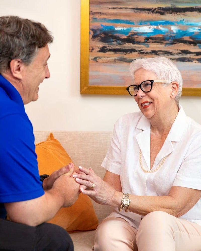 arbor terrace resident being helped by staff in apartment