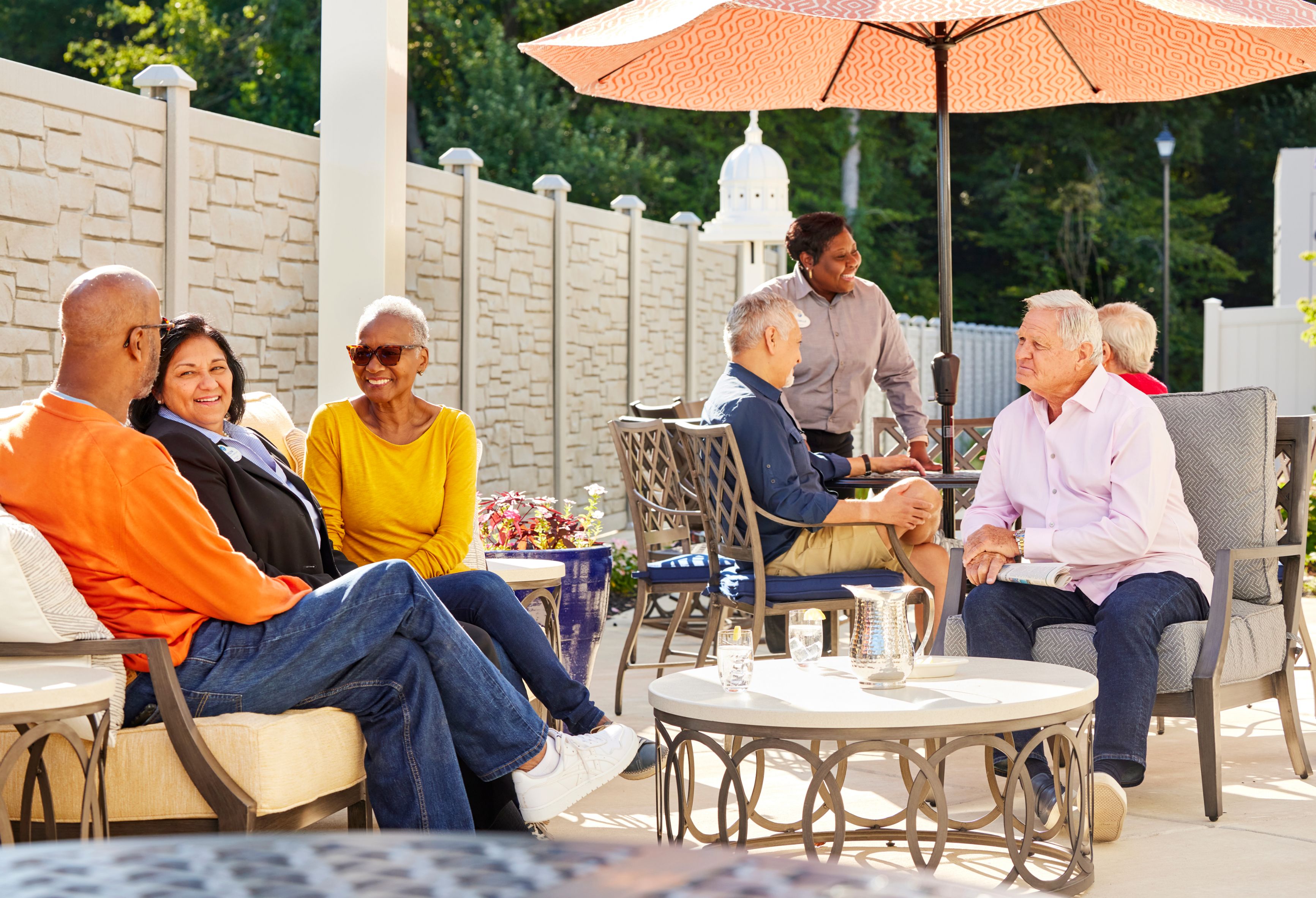 arbor terrace residents enjoy outdoors with staff