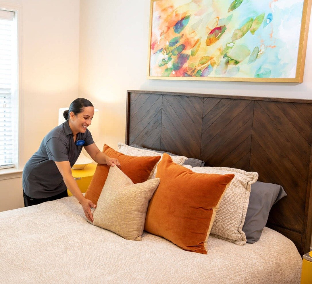 arbor terrace housekeeping staff fixing pillows